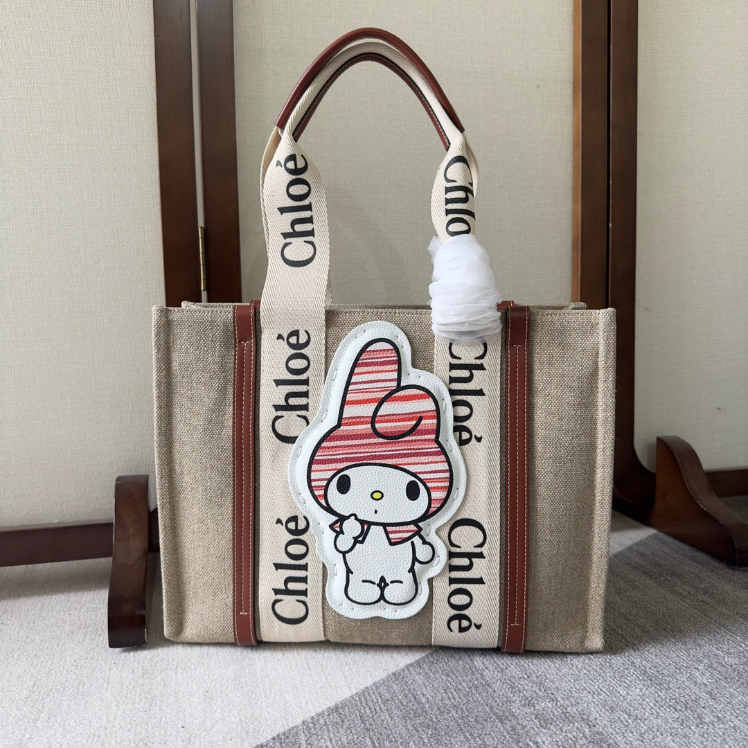 MY MELODY MEDIUM WOODY TOTE BAG 37 IN NATURAL FIBERS BEIGE WEBBING BROWN CALFSKIN